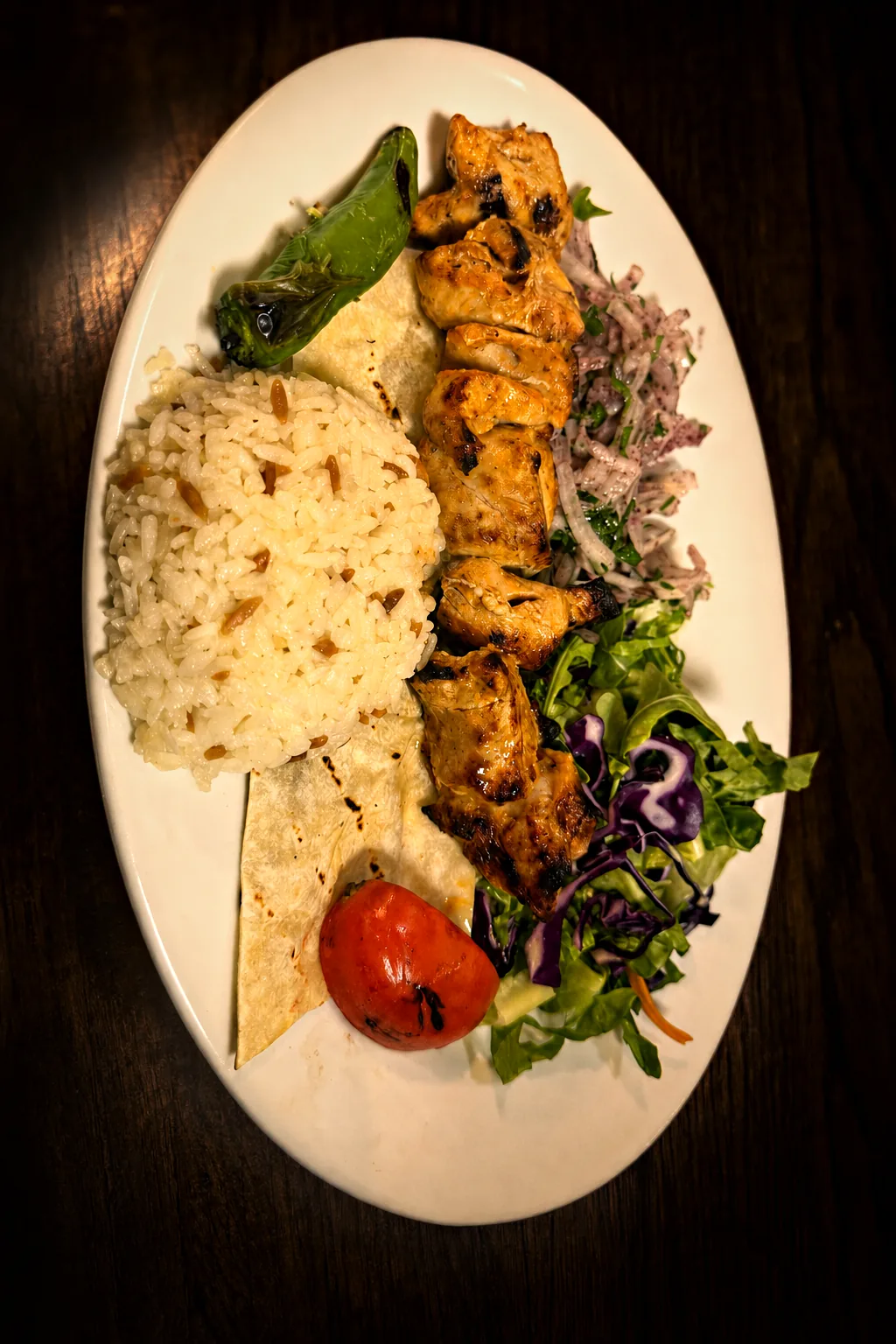 Chicken shish skewer with rice, salad and lavash