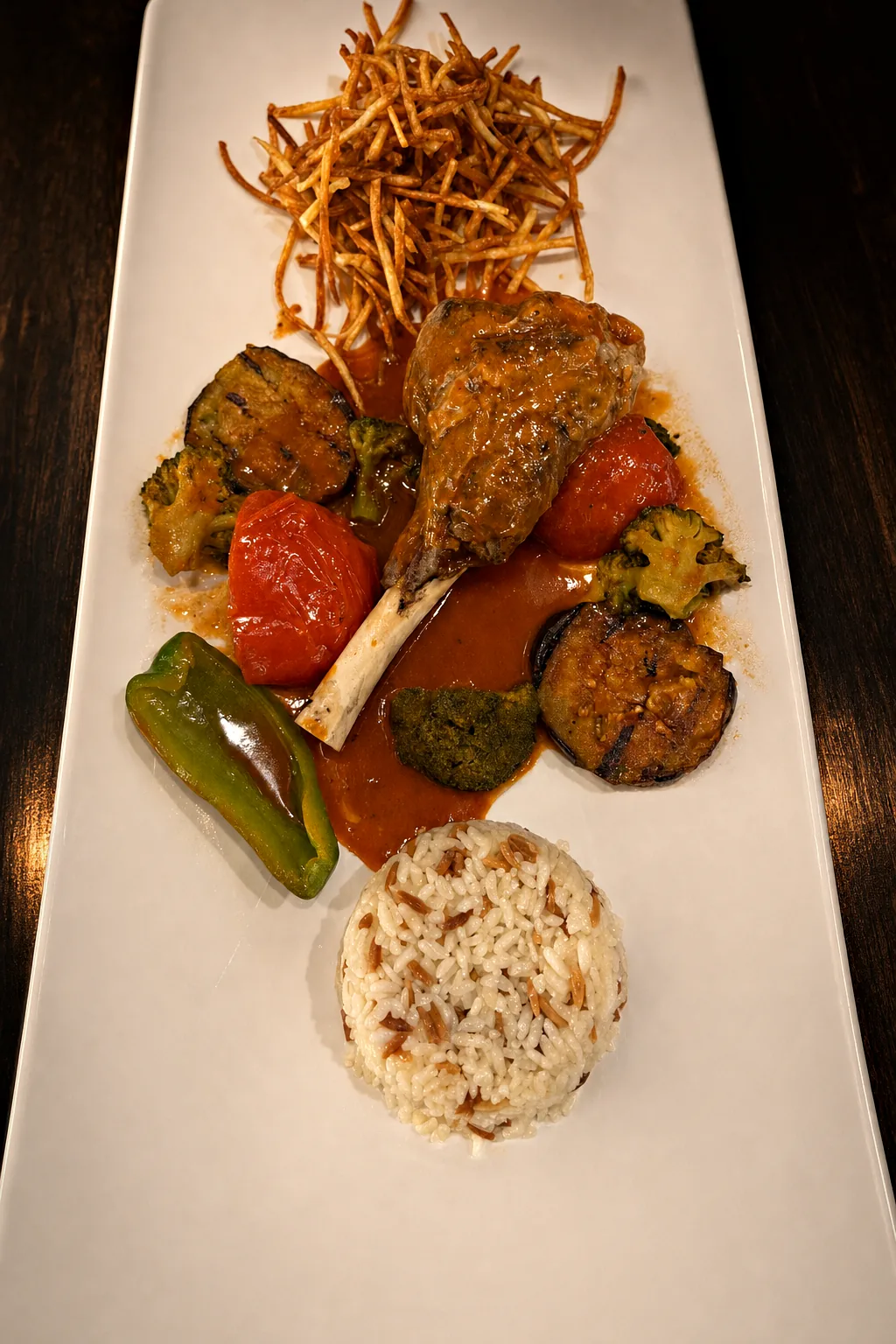 İslim kebabı — lamb shank with rice, tomato, pepper and broccoli in sauce