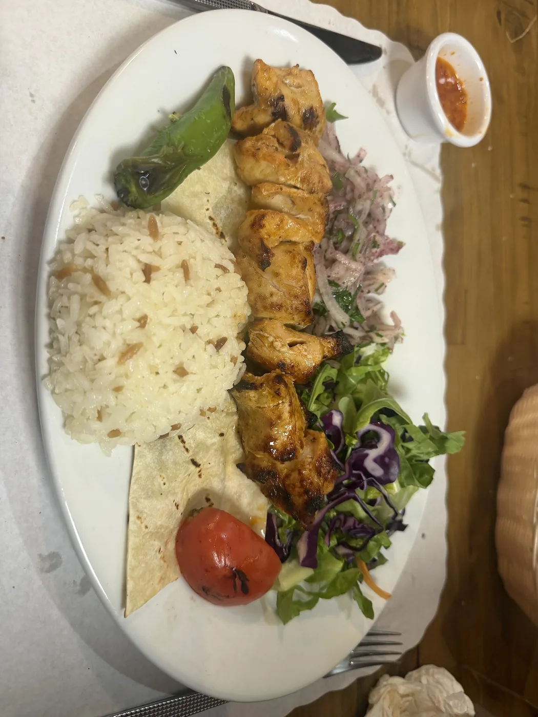 Chicken shish skewer with rice, salad and lavash